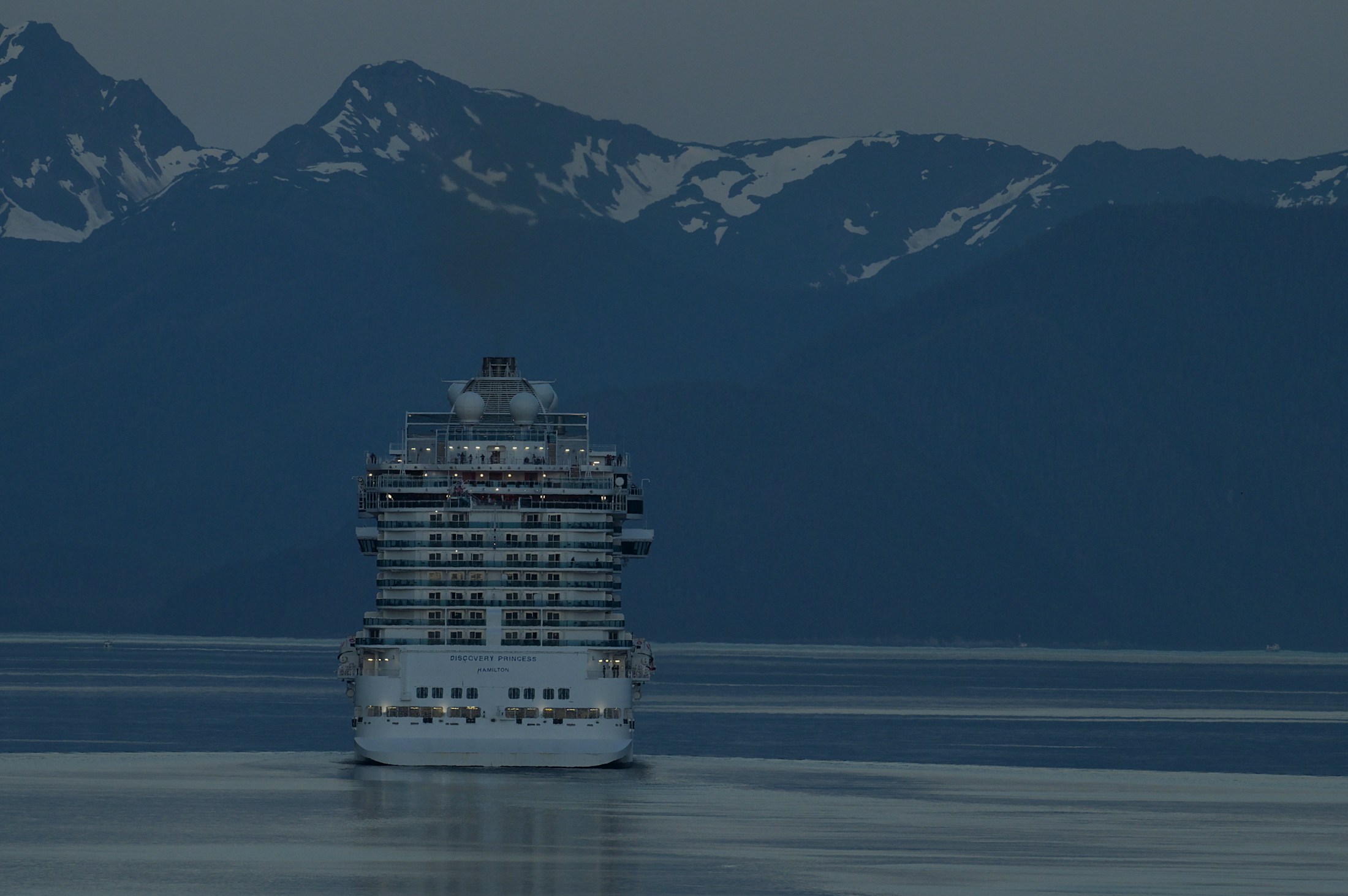 A cruise ship beneath the mountains near Juneau