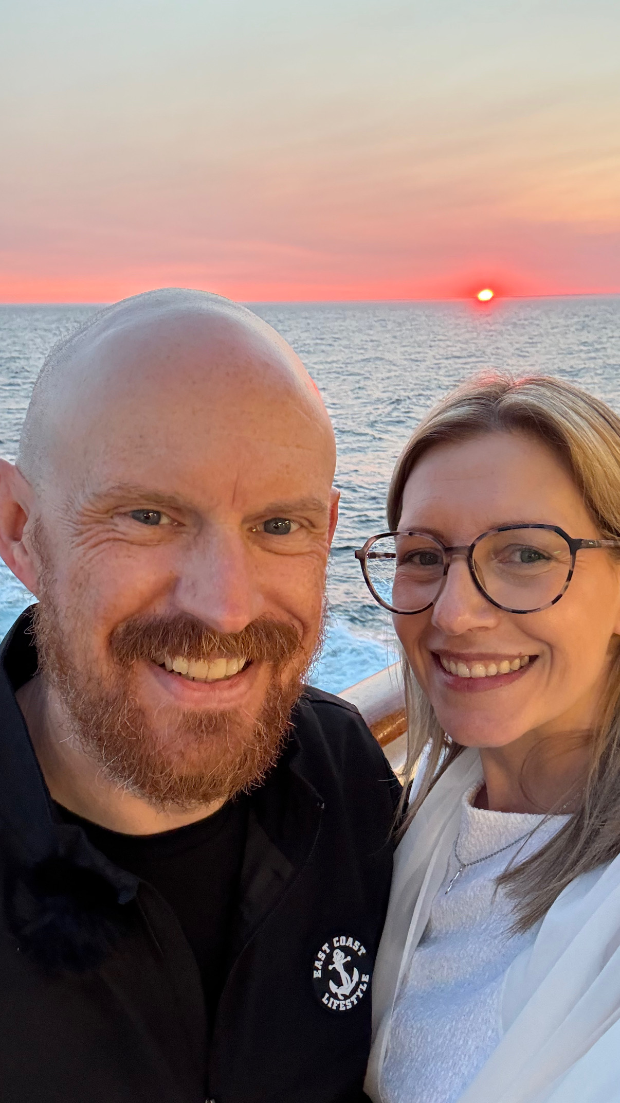 Steph and Rick together on deck at sunset